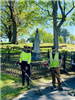 2 workers standing near the Laurel Hill Cemetery