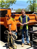 2 DPW Workers standing near a truck