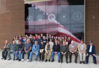 Veterans Sitting out front of High School